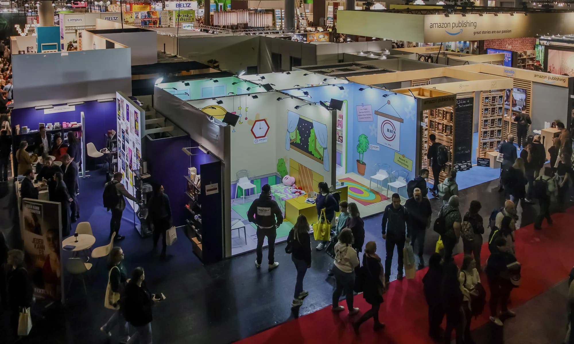 Large exhibition hall with organized technical setup and booth structures