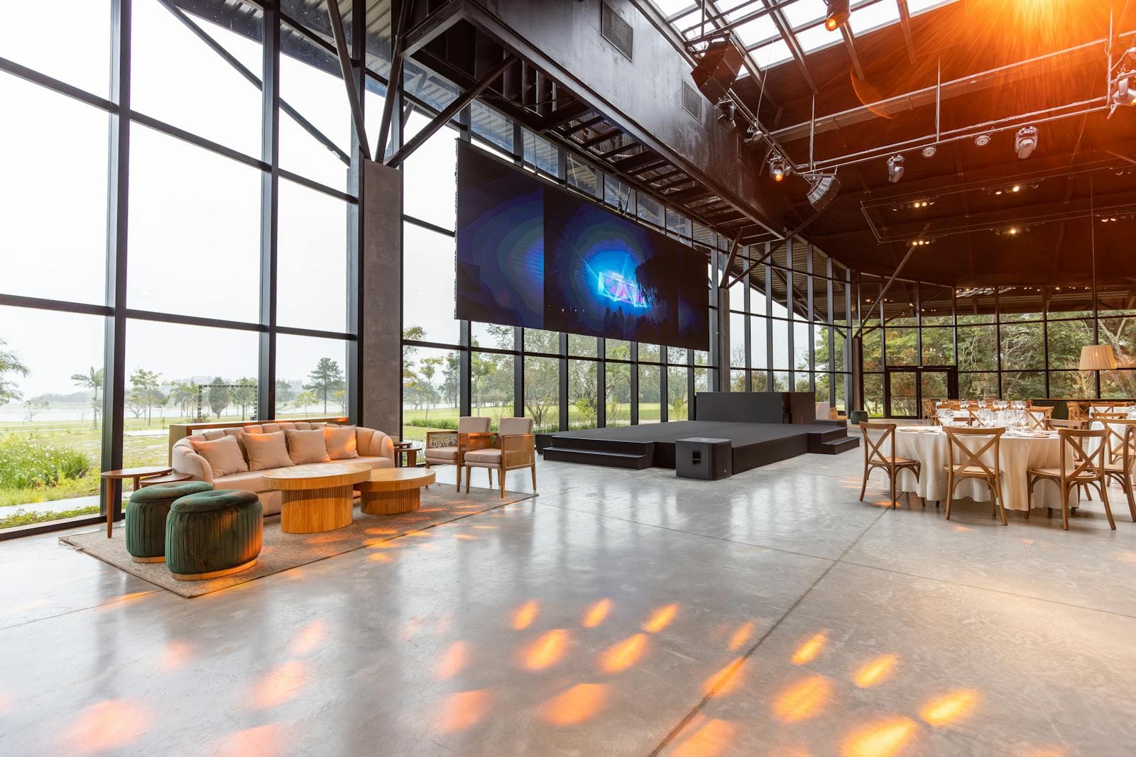 Large projection screen and AV setup in a professional event hall